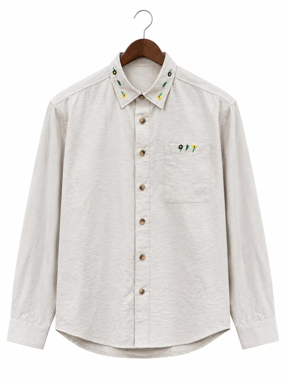 Light-coloured long-sleeve button-front shirt on a hanger