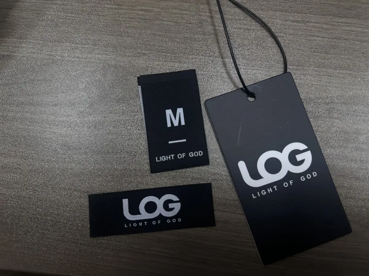 Fabric brand label, M size label and hang tag supplied for clothing artwork review